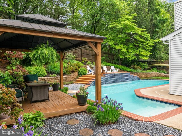 275 Tolstoy Ln, Severna Park, MD 21146 - swimming pool featuring a gazebo, a deck, and fence