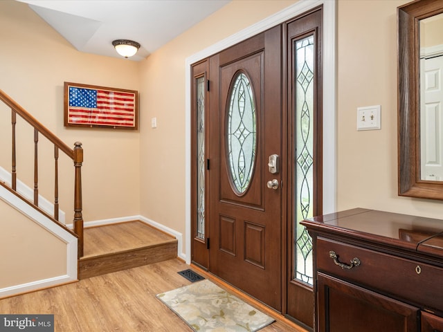275 Tolstoy Ln, Severna Park, MD 21146 - foyer with light wood-type flooring, stairway, and baseboards