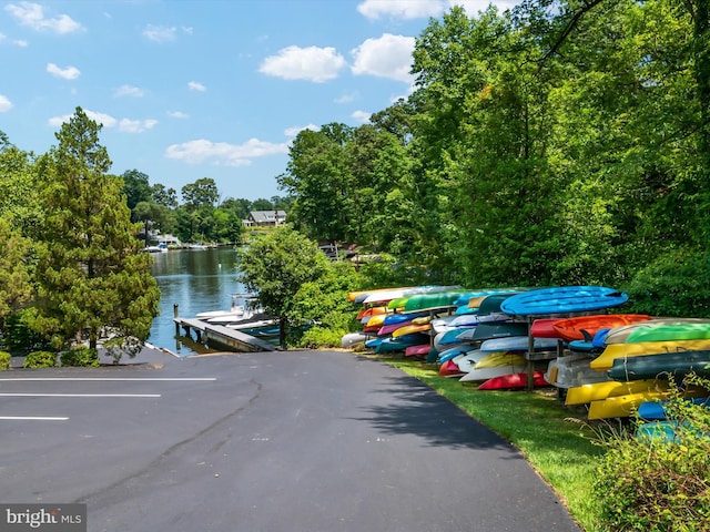 275 Tolstoy Ln, Severna Park, MD 21146 - uncovered parking lot with a boat dock and a water view