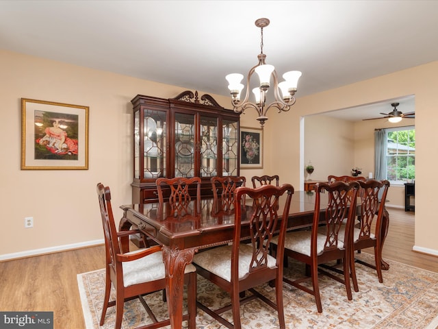 275 Tolstoy Ln, Severna Park, MD 21146 - dining area featuring a chandelier, light wood-style flooring, baseboards, and a ceiling fan