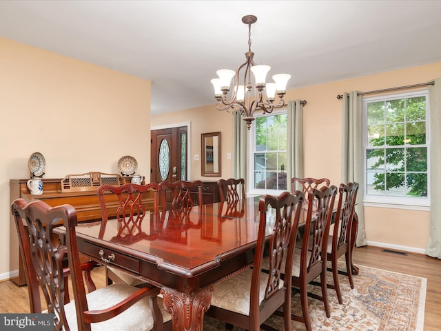 275 Tolstoy Ln, Severna Park, MD 21146 - dining room with a chandelier, baseboards, and light wood finished floors