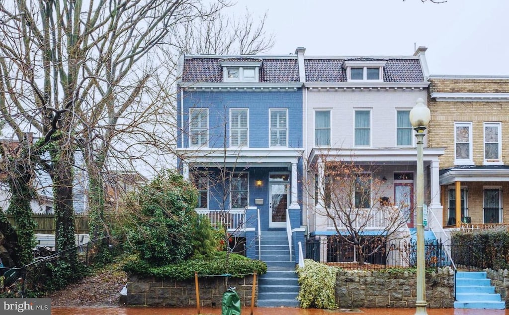 304 12th St NE, Washington, DC 20002 - view of front of property featuring stairs, mansard roof, covered porch, and brick siding