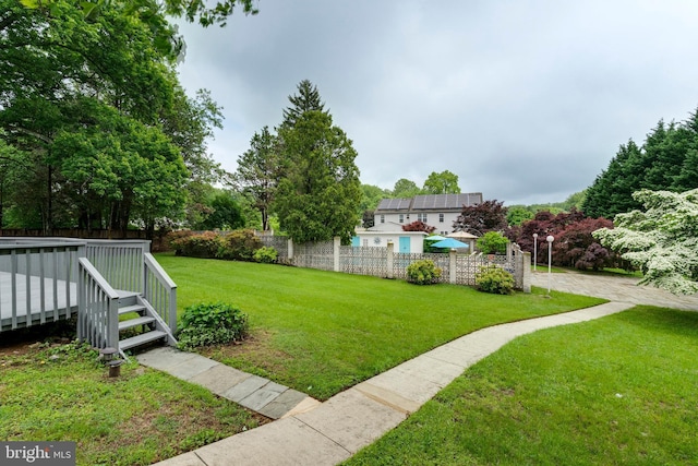 view of yard with a wooden deck