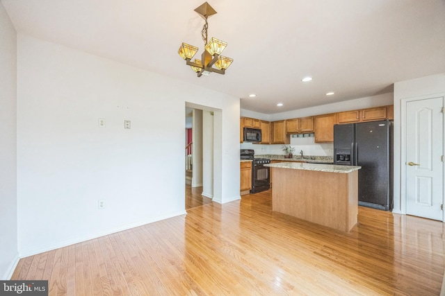 504 Nottingham Pl, Riverside, NJ 08075 - kitchen with black appliances, light wood-style floors, baseboards, a chandelier, and recessed lighting