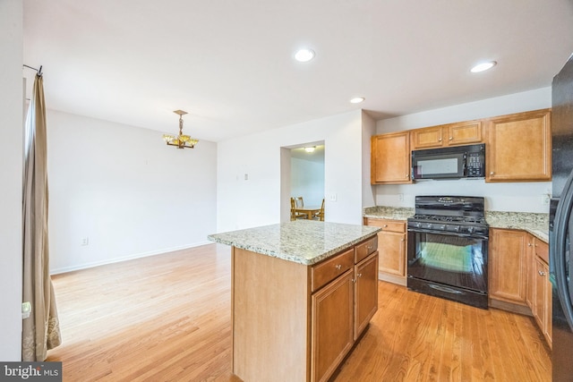 504 Nottingham Pl, Riverside, NJ 08075 - kitchen featuring black appliances, light wood-type flooring, light stone counters, a kitchen island, and recessed lighting