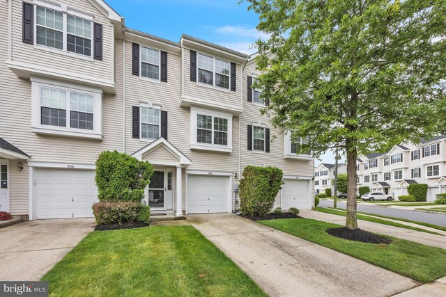 504 Nottingham Pl, Riverside, NJ 08075 - multi unit property with driveway, an attached garage, a residential view, and a front yard