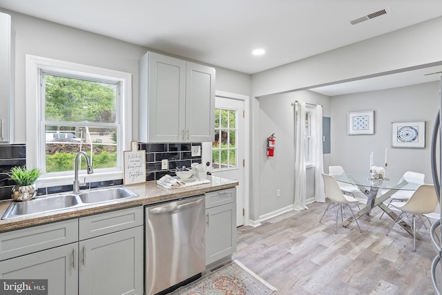 136 Pembrown Rd, Browns Mills, NJ 08015 - kitchen featuring stainless steel dishwasher, a sink, decorative backsplash, light wood finished floors, and recessed lighting