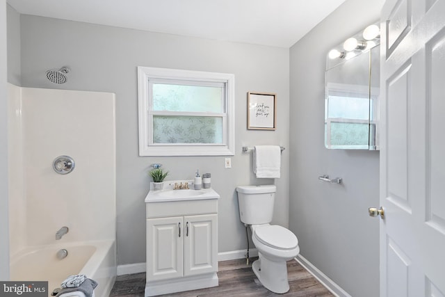 136 Pembrown Rd, Browns Mills, NJ 08015 - bathroom featuring wood finished floors, toilet, vanity, shower / washtub combination, and baseboards