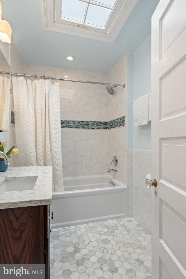 bathroom with shower / bath combo with shower curtain, vanity, and recessed lighting