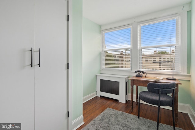 home office featuring wood finished floors and baseboards