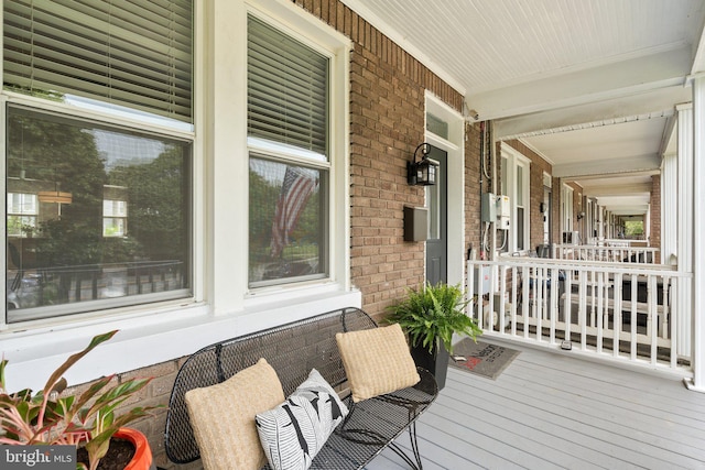 wooden deck featuring covered porch