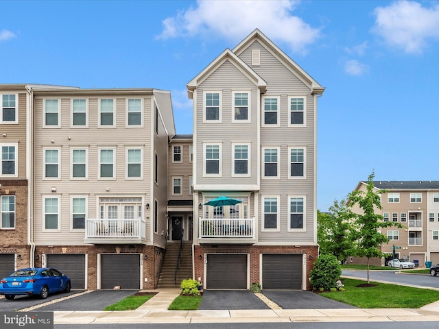5920 Forum Sq ., Unit Frederick, MD 21703 - multi unit property featuring a garage, brick siding, and driveway