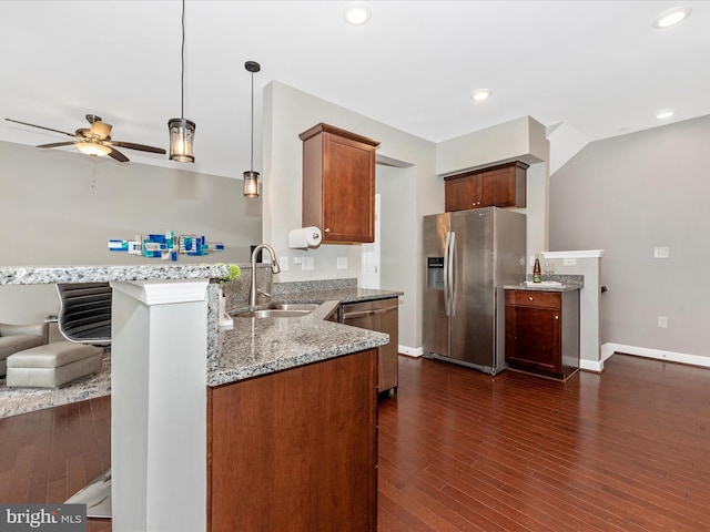 5920 Forum Sq ., Unit Frederick, MD 21703 - kitchen with stainless steel appliances, a sink, ceiling fan, a peninsula, and light stone counters
