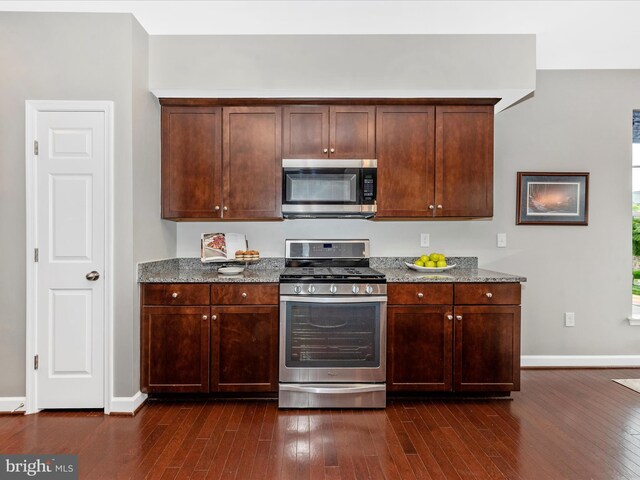 5920 Forum Sq ., Unit Frederick, MD 21703 - kitchen with stainless steel appliances, dark wood finished floors, and light stone counters