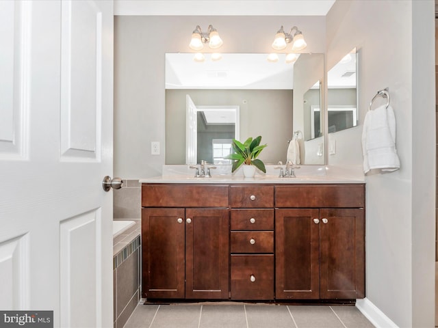 5920 Forum Sq ., Unit Frederick, MD 21703 - full bath featuring double vanity, a relaxing tiled tub, and tile patterned floors