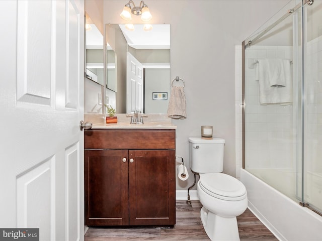 5920 Forum Sq ., Unit Frederick, MD 21703 - bathroom featuring toilet, wood finished floors, vanity, and bath / shower combo with glass door