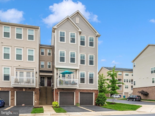 5920 Forum Sq ., Unit Frederick, MD 21703 - townhome / multi-family property with brick siding, an attached garage, and driveway