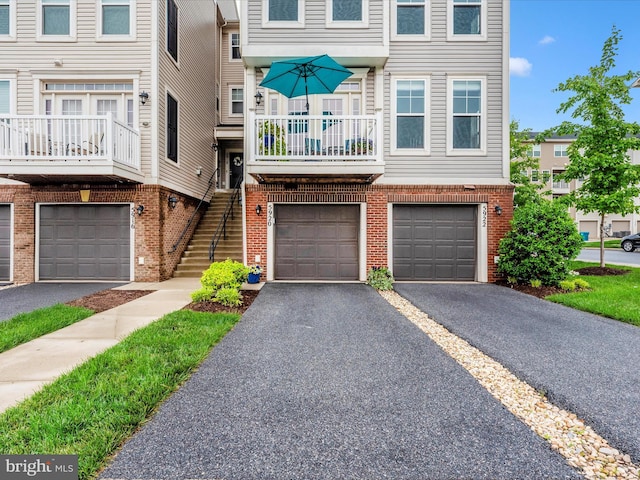 5920 Forum Sq ., Unit Frederick, MD 21703 - multi unit property with an attached garage, brick siding, driveway, and stairway
