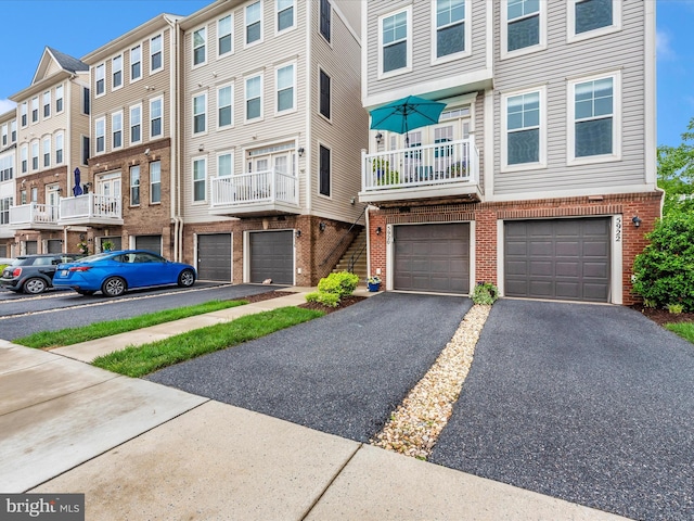 5920 Forum Sq ., Unit Frederick, MD 21703 - view of front of home with brick siding, a garage, and driveway