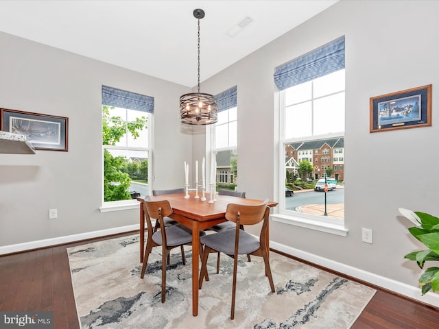 5920 Forum Sq ., Unit Frederick, MD 21703 - dining space featuring a chandelier, baseboards, and wood-type flooring