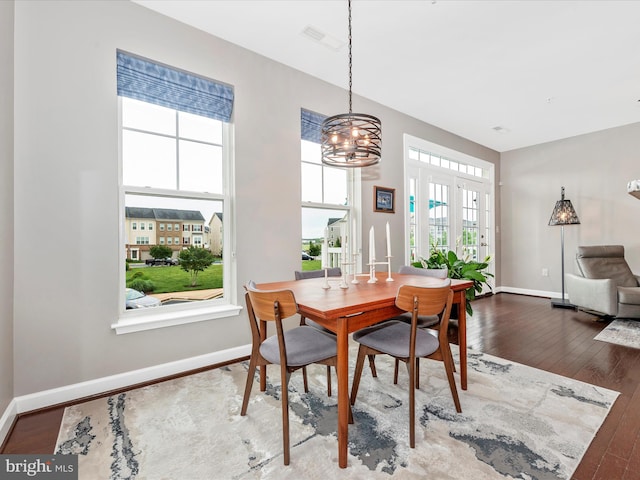 5920 Forum Sq ., Unit Frederick, MD 21703 - dining area with hardwood / wood-style floors, baseboards, and a chandelier