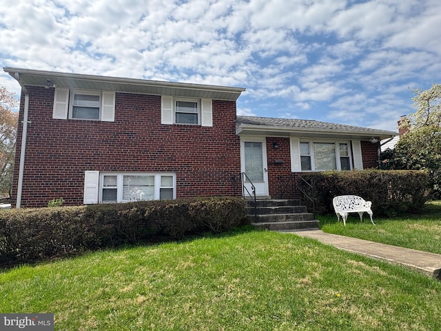 12102 Hunters Ln, Rockville, MD 20852 - split level home featuring brick siding, a front yard, and entry steps
