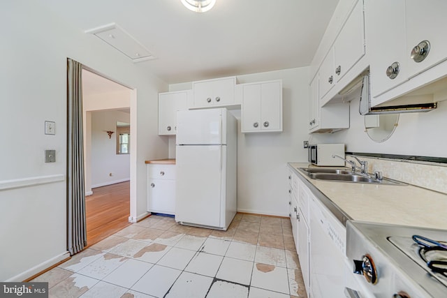 12102 Hunters Ln, Rockville, MD 20852 - kitchen with white appliances, white cabinetry, light countertops, and a sink