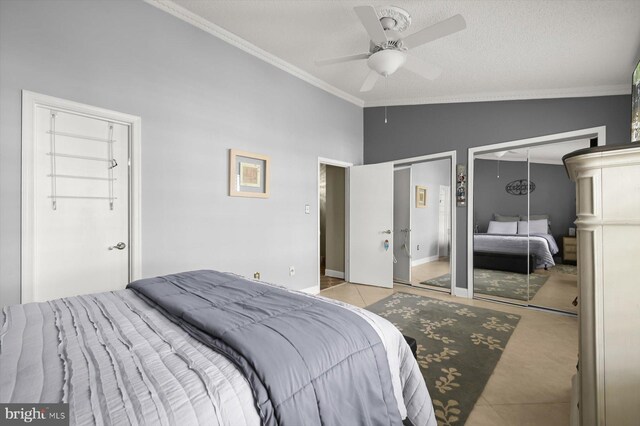 737 Saint Michaels Dr, Bowie, MD 20721 - tiled bedroom featuring two closets, crown molding, vaulted ceiling, carpet floors, and a ceiling fan
