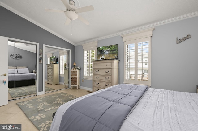 737 Saint Michaels Dr, Bowie, MD 20721 - tiled bedroom with crown molding, vaulted ceiling, two closets, a ceiling fan, and a textured ceiling