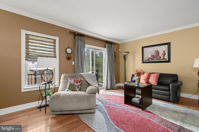 737 Saint Michaels Dr, Bowie, MD 20721 - living room featuring ornamental molding, baseboards, and wood finished floors