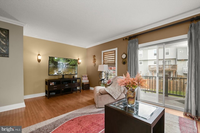 737 Saint Michaels Dr, Bowie, MD 20721 - living room with wood finished floors, baseboards, and crown molding