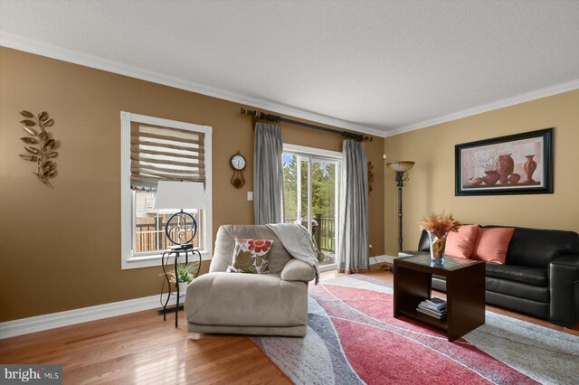737 Saint Michaels Dr, Bowie, MD 20721 - living area featuring crown molding, wood finished floors, and baseboards