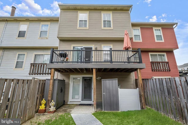 737 Saint Michaels Dr, Bowie, MD 20721 - rear view of house with a balcony and a fenced backyard