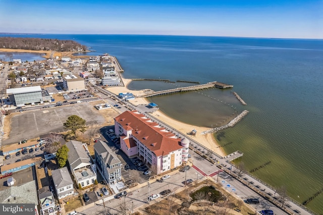 aerial view of property and surrounding area featuring a large body of water
