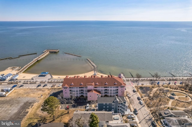 bird's eye view of a nearby body of water and apartment complex / building