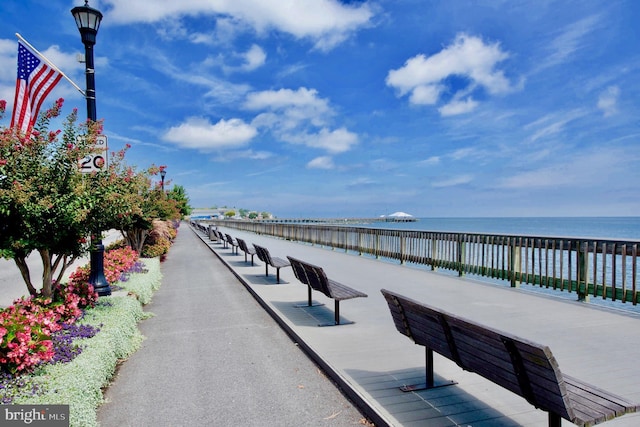 view of home's community with a water view