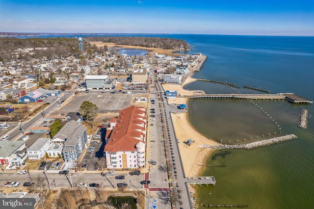 aerial view of property's location with a large body of water