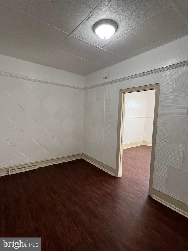 4714 Woodland Ave, Philadelphia, PA 19143 - empty room with dark wood-style floors and baseboards