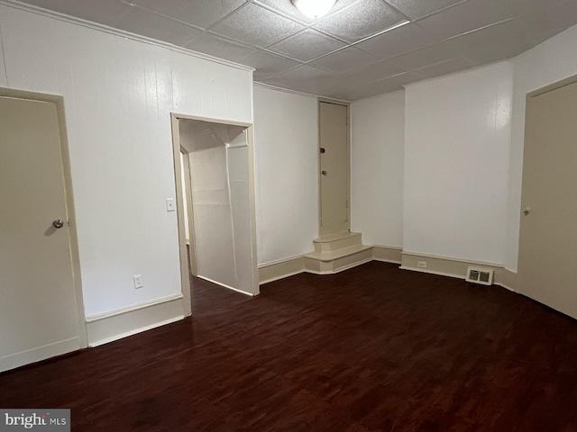 4714 Woodland Ave, Philadelphia, PA 19143 - unfurnished room featuring wood finished floors, baseboards, and a paneled ceiling