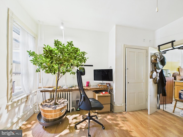 4714 Woodland Ave, Philadelphia, PA 19143 - office space with light wood-style flooring and radiator heating unit