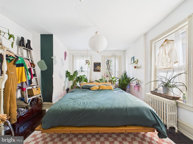 4714 Woodland Ave, Philadelphia, PA 19143 - bedroom with radiator and wood finished floors