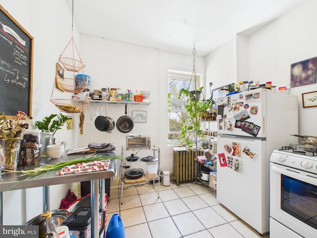 4714 Woodland Ave, Philadelphia, PA 19143 - kitchen featuring white appliances, radiator heating unit, and light tile patterned flooring