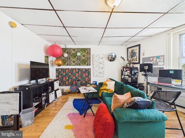 4714 Woodland Ave, Philadelphia, PA 19143 - living room with wood finished floors and a drop ceiling