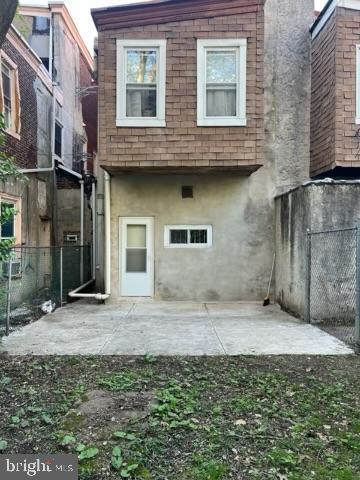 4714 Woodland Ave, Philadelphia, PA 19143 - back of property with fence and a patio area