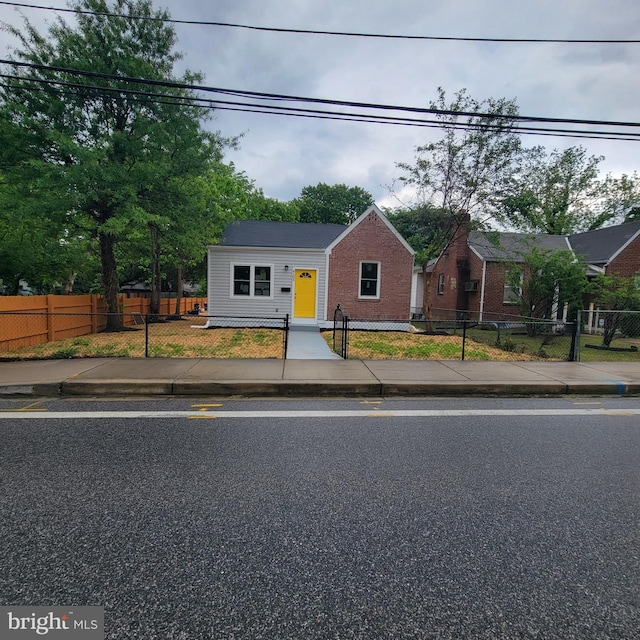 4105 38th St, Brentwood, MD 20722 - bungalow-style house featuring brick siding and a fenced front yard