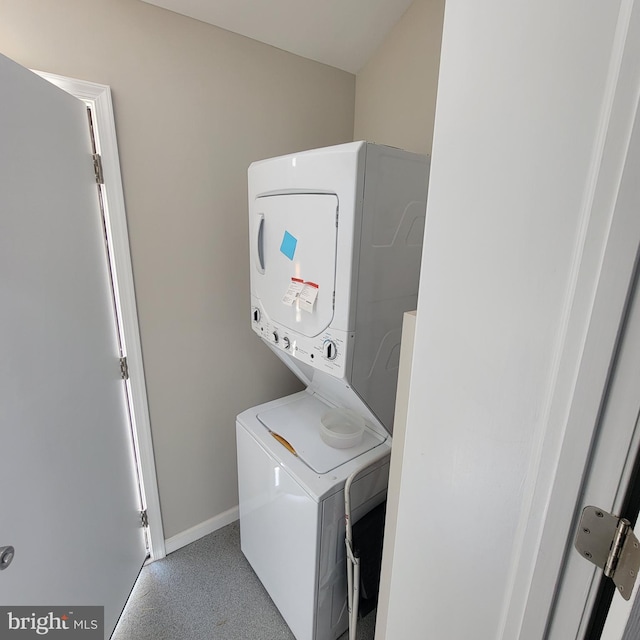4105 38th St, Brentwood, MD 20722 - laundry room with stacked washer and clothes dryer and baseboards