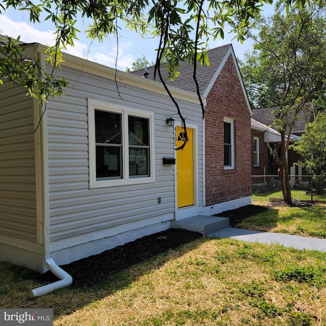 4105 38th St, Brentwood, MD 20722 - view of front of property featuring brick siding and roof with shingles