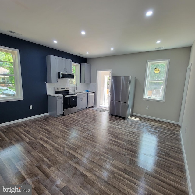 4105 38th St, Brentwood, MD 20722 - kitchen with appliances with stainless steel finishes, light countertops, recessed lighting, dark wood-type flooring, and baseboards