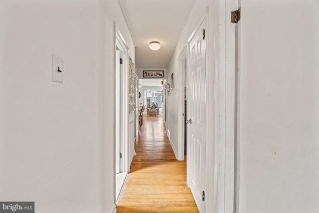 corridor featuring light wood-style floors