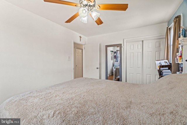 bedroom featuring a closet and ceiling fan